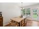 Dining room features hardwood floors, large window and door with view of backyard at 1928 Gasque St, Johns Island, SC 29455