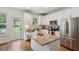 Beautiful kitchen with granite counters, stainless appliances, and door to backyard at 1928 Gasque St, Johns Island, SC 29455