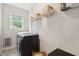 Laundry room with modern appliances, shelving, and tiled floor at 1928 Gasque St, Johns Island, SC 29455