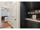 Walk-in pantry has elegant blue walls and convenient storage shelves with marble countertops at 1928 Gasque St, Johns Island, SC 29455