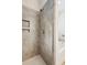 Bathroom shower featuring a mosaic tile accent and built-in shampoo niche at 1928 Gasque St, Johns Island, SC 29455