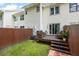 Inviting backyard showcasing a wooden deck with seating and serene outdoor space at 201 Pine Shadow Dr, Goose Creek, SC 29445