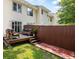 Relaxing backyard area with patio, seating, and a well-maintained fence for privacy at 201 Pine Shadow Dr, Goose Creek, SC 29445