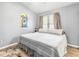 Bedroom featuring white and gray linens, gray walls, and natural light at 201 Pine Shadow Dr, Goose Creek, SC 29445