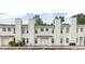 Inviting townhouse complex showcases well-maintained landscaping, and convenient parking at 201 Pine Shadow Dr, Goose Creek, SC 29445
