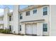 Charming townhouse with neutral siding, and a manicured garden, offering a welcoming curb appeal at 201 Pine Shadow Dr, Goose Creek, SC 29445