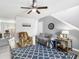 Relaxing living room featuring comfortable seating, a ceiling fan, and a view into the dining area at 201 Pine Shadow Dr, Goose Creek, SC 29445