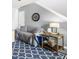 A cozy living room showcases a comfortable sofa, modern lighting, and a decorative rug at 201 Pine Shadow Dr, Goose Creek, SC 29445