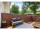 Charming outdoor patio features a cozy seating area with stylish decor and privacy fence at 201 Pine Shadow Dr, Goose Creek, SC 29445