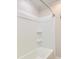 White shower and bathtub with matching tile and shower head at 208 State St, Walterboro, SC 29488