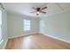 Light and airy bedroom with hardwood floors, a ceiling fan, and bright natural light at 208 State St, Walterboro, SC 29488