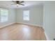 Large, airy bedroom with two windows and hardwood floors, perfect for relaxation and rest at 208 State St, Walterboro, SC 29488