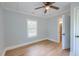 Bedroom with a ceiling fan, light-blue walls, and a window at 208 State St, Walterboro, SC 29488