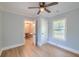 Bedroom with a window and a ceiling fan, and an open door at 208 State St, Walterboro, SC 29488