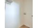 Walk in closet with light wood floors at 208 State St, Walterboro, SC 29488