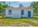 White house with a dark-gray door and some windows at 208 State St, Walterboro, SC 29488
