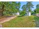 Expansive lush yard with a detached building and charming two-story house at 208 State St, Walterboro, SC 29488