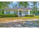 Charming single-story home with covered porch and well-maintained landscaping at 208 State St, Walterboro, SC 29488