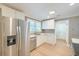 Contemporary kitchen with stainless steel appliances, white cabinetry, and bright lighting at 208 State St, Walterboro, SC 29488