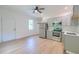 Kitchen with stainless steel appliances, white countertops, and light wood floors at 208 State St, Walterboro, SC 29488
