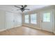 Bright room featuring neutral walls, ceiling fan, and wood-look flooring at 208 State St, Walterboro, SC 29488