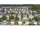 A picturesque aerial view displays a vibrant residential area with tree-lined streets at 209 Barberry St, Summerville, SC 29483