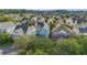 A beautiful aerial view showcases a neighborhood with colorful homes and lush green trees at 209 Barberry St, Summerville, SC 29483