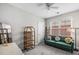 Inviting bedroom with a stylish green velvet sofa and natural light from the window at 209 Barberry St, Summerville, SC 29483