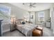Bright bedroom with a cozy bed, ceiling fan, and windows allowing plenty of natural light; perfect for relaxing at 209 Barberry St, Summerville, SC 29483