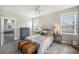 Comfortable bedroom with a cozy bed, ceiling fan, and windows allowing plenty of natural light; furniture adds charm at 209 Barberry St, Summerville, SC 29483
