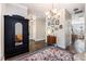 Elegant entryway featuring dark wood floors, a large mirror, and decorative furnishings at 209 Barberry St, Summerville, SC 29483