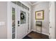 Bright entryway with hardwood floors, stylish decor, and plenty of natural light at 209 Barberry St, Summerville, SC 29483