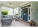 Inviting front porch with comfortable seating, perfect for relaxing and enjoying the outdoors at 209 Barberry St, Summerville, SC 29483