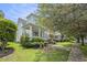 Charming two-story house with a welcoming front porch and lush landscaping at 209 Barberry St, Summerville, SC 29483