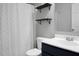 Functional bathroom featuring a toilet, sink, and shower with stylish shelving for extra storage at 213 Avonshire Dr, Summerville, SC 29483
