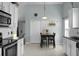 Eat-in kitchen with white cabinets, stainless steel appliances, and a cozy dining area at 213 Avonshire Dr, Summerville, SC 29483