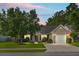 Charming one-story home with manicured lawn, mature trees, and attached two-car garage in quiet neighborhood at 213 Avonshire Dr, Summerville, SC 29483