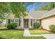 Inviting front of house with a landscaped yard and a concrete walkway leading to a front door at 213 Avonshire Dr, Summerville, SC 29483