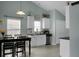 Bright eat-in kitchen with white cabinets, stainless steel appliances, and plenty of counter space at 213 Avonshire Dr, Summerville, SC 29483