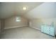 Attic with light colored walls, carpet, and a window at 215 Bramblewood Dr, Summerville, SC 29485