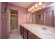 Bathroom features dual sinks, dark wood cabinets, and a separate shower room at 215 Bramblewood Dr, Summerville, SC 29485