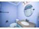 Powder blue bathroom features a granite vanity, oval mirror, and new fixtures at 215 Bramblewood Dr, Summerville, SC 29485