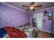 Bedroom features colorful decor, wood-look floors, ceiling fan, and natural light at 215 Bramblewood Dr, Summerville, SC 29485
