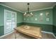 Inviting dining room featuring modern chandelier, wainscotting, and neutral décor at 215 Bramblewood Dr, Summerville, SC 29485