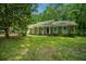 Charming brick home featuring well-maintained lawn, front porch, and colorful shutters at 215 Bramblewood Dr, Summerville, SC 29485