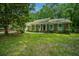 Charming brick home featuring well-maintained lawn, front porch, and colorful shutters at 215 Bramblewood Dr, Summerville, SC 29485