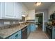 Well-lit kitchen featuring granite countertops, stainless appliances, and classic cabinetry at 215 Bramblewood Dr, Summerville, SC 29485