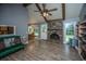 Bright living room boasts a fireplace, hardwood floors, and ample natural light at 215 Bramblewood Dr, Summerville, SC 29485