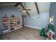 Bright living room featuring hardwood floors, exposed beams, and built-in shelving at 215 Bramblewood Dr, Summerville, SC 29485
