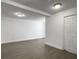Unfinished basement space featuring modern gray flooring and multiple entry and exit doors at 2174 Eleanor Dr, North Charleston, SC 29406